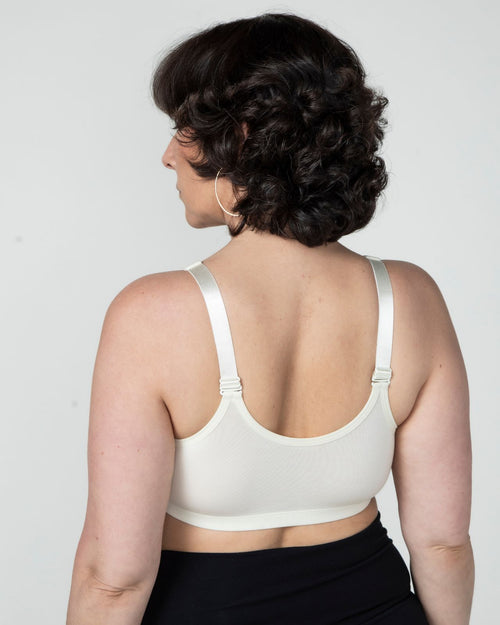 Ivory / Flat & pocketed front closure wire free bra with adjustable straps on flat model back view