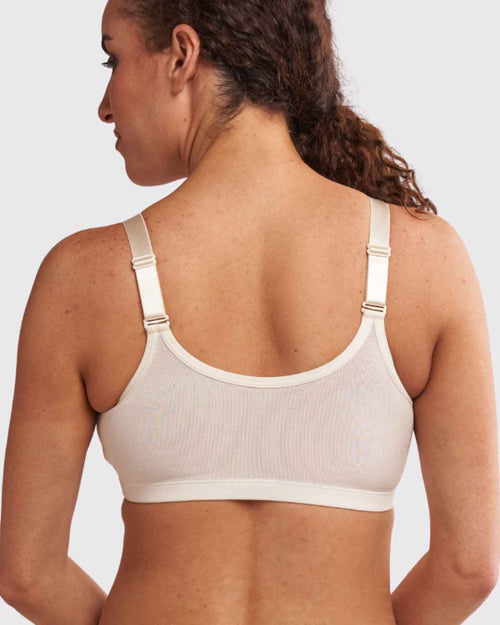 Ivory / Flat & pocketed front closure wire free bra with adjustable straps on flat model back view