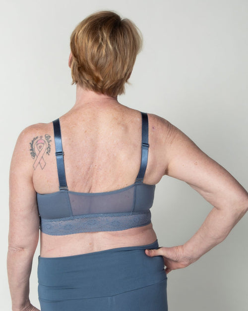 Slate / Au Natural & longline pullover bra with a lace trim, soft cups, mesh back, adjustable straps on model.