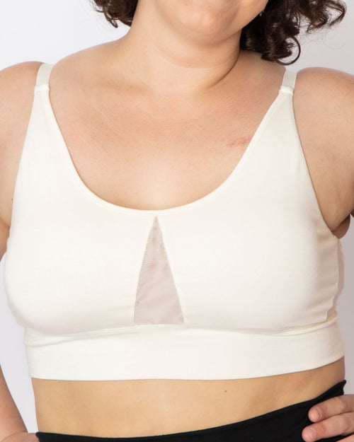 Ivory / Implants & pocketed leisure lounge bra with mesh side panels and underwire free design on implant reconstruction model chest view