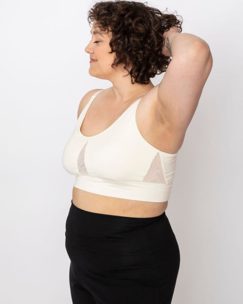 Ivory / Implants & pocketed leisure lounge bra with mesh side panels and underwire free design on implant reconstruction model side view