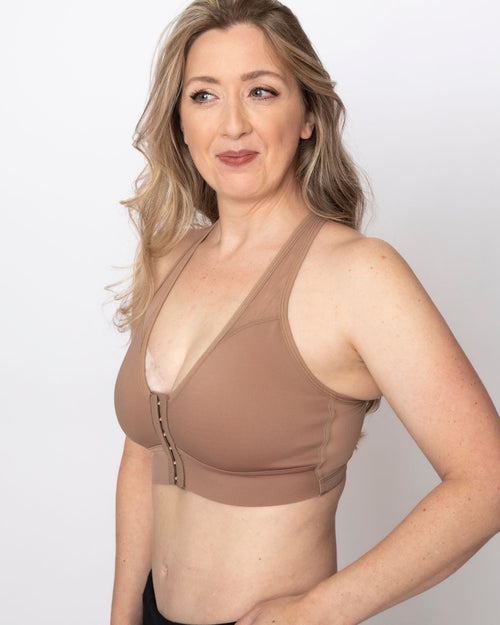 Sand / Implants & pocketed front closure sports bra with mesh back panel on implant reconstruction side view