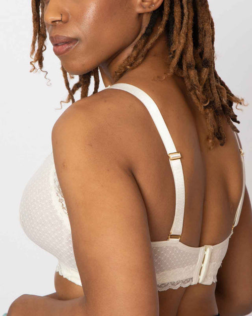 Black / Au Natural & pocketed wrap front lace bralette with wireless cups, back closure and adjustable straps on au natural model.