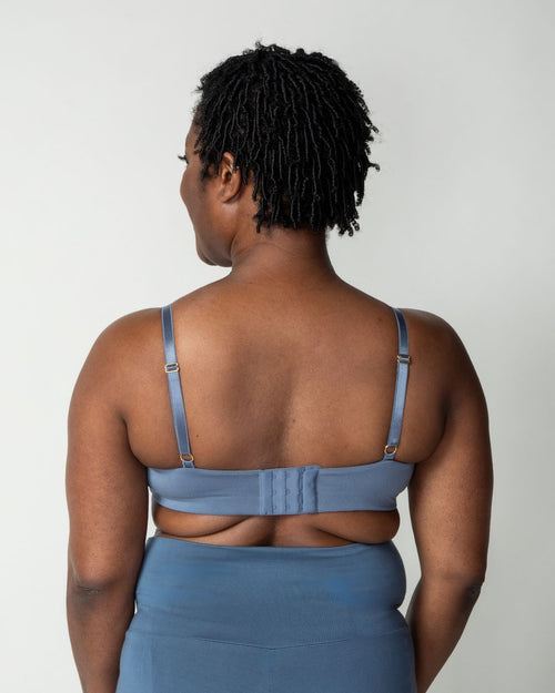 Slate / Au Natural  & pocketed plunge t-shirt bra with soft wire free cups, back hook closure and adjustable straps on model.