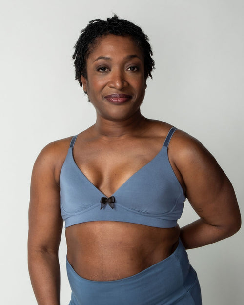 Slate / Implants & pocketed plunge t-shirt bra with soft wire free cups, back hook closure and adjustable straps on implants model.