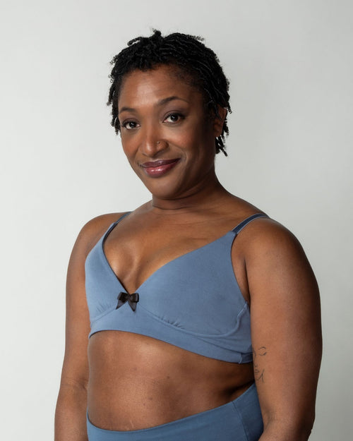 Slate / Implants & pocketed plunge t-shirt bra with soft wire free cups, back hook closure and adjustable straps on implants model.