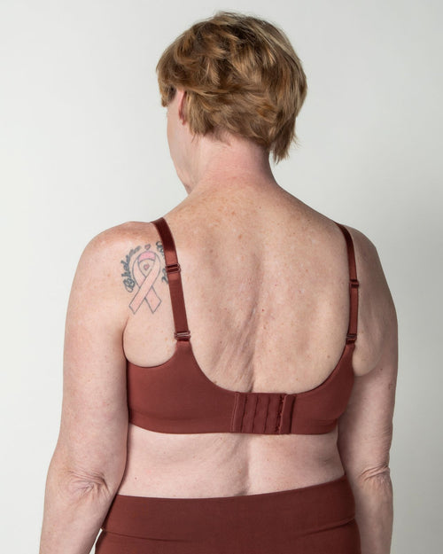 Sienna / Flap Reconstruction & pocketed full coverage t-shirt bra with soft wire free cups, back hook closure and adjustable straps on model.